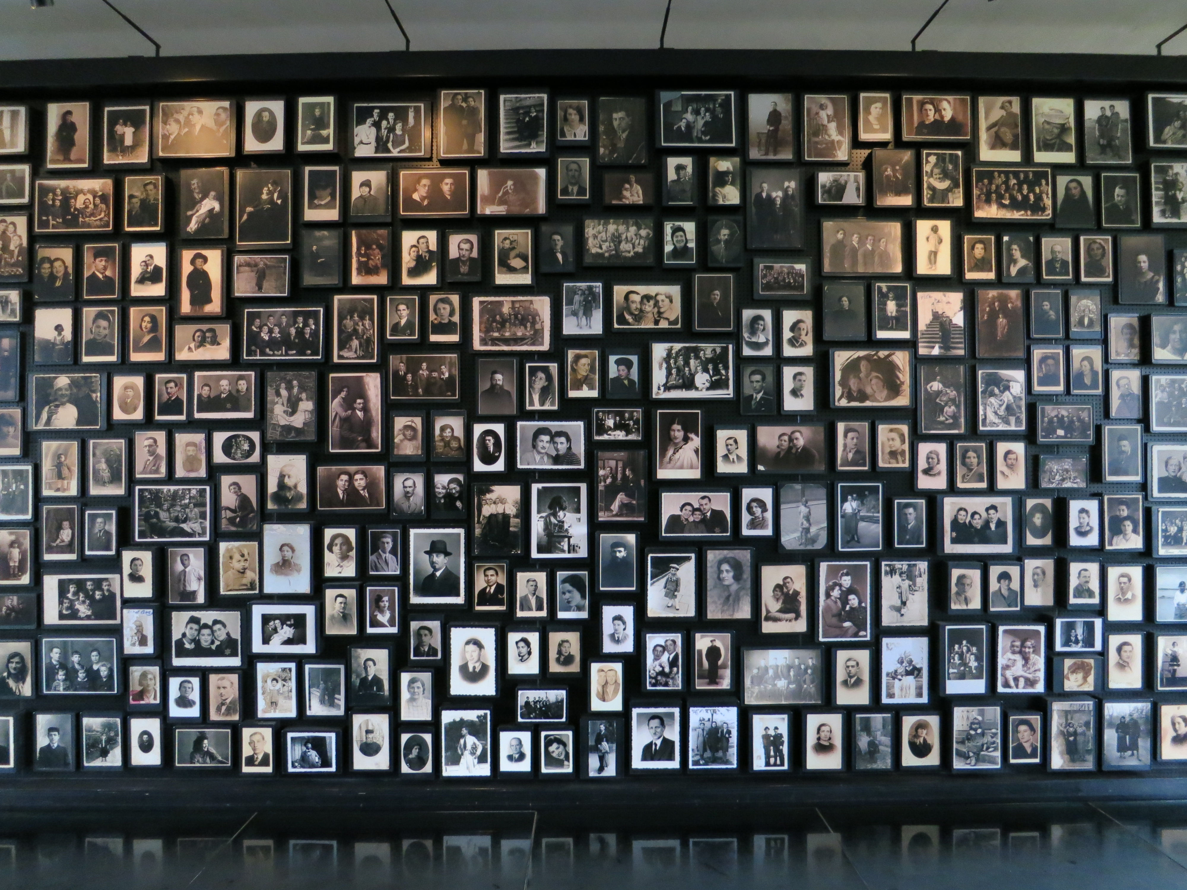 Image of a collection of victims' photos at the Auschwitz-Birkenau Museum and Memorial, 2017