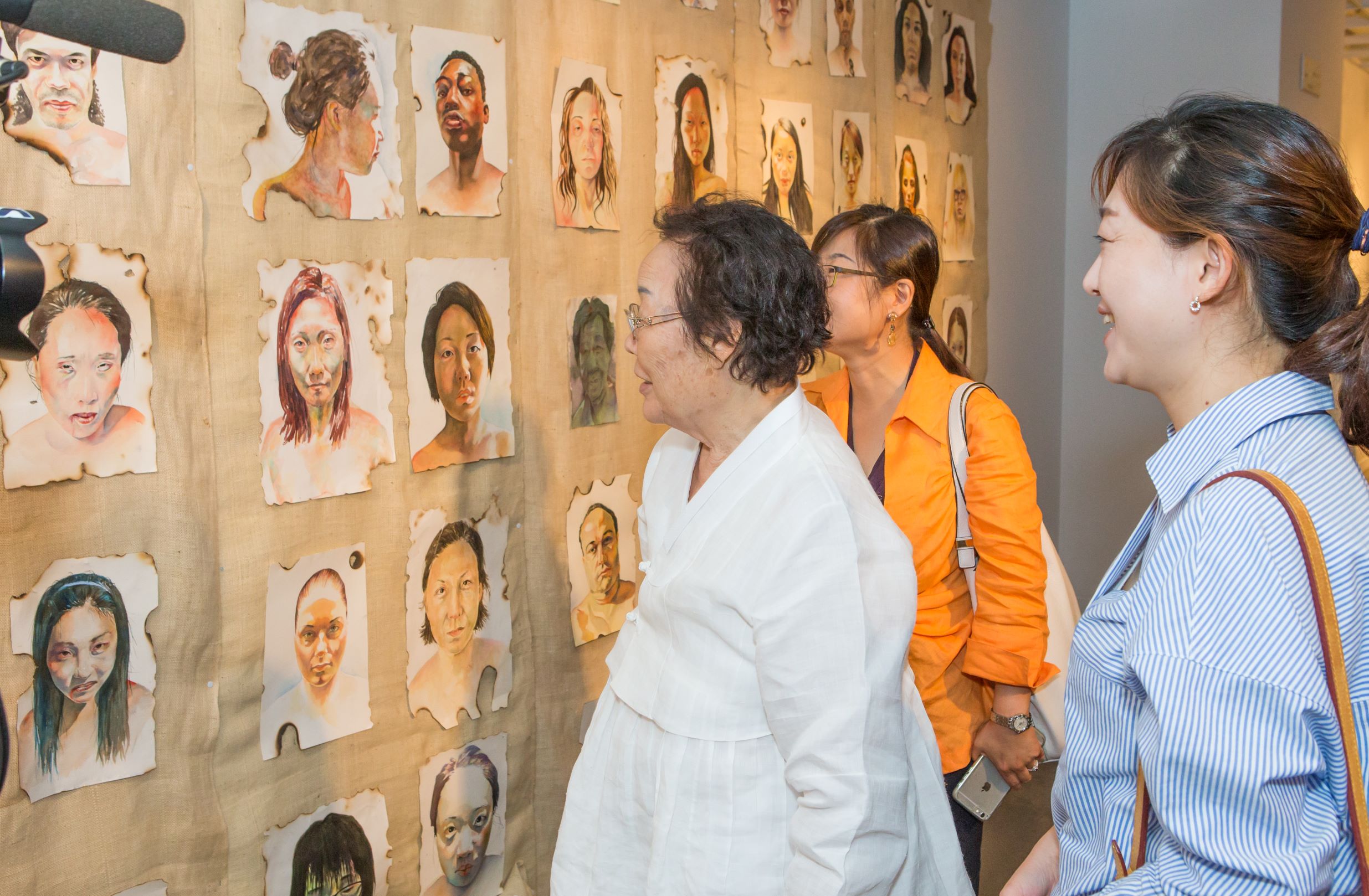 Image of a Korean Comfort Woman survivor views exhibition installation at the KHC.
